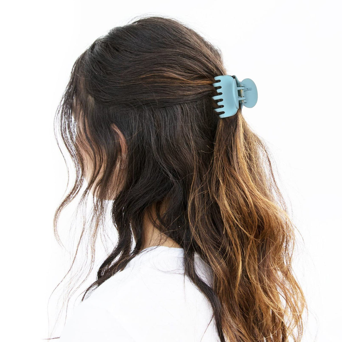 DEEKA Hair Clip in matte green on a model's hair