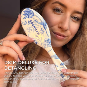 Denman Boar Bristle Hair Brush in use on curly hair