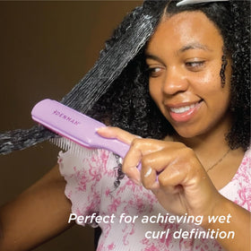 Denman Curly Hair Brush D3 with packaging on a flat surface