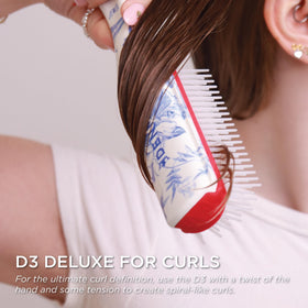 Denman D3 brush in use on curly hair