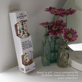 Denman D3 Curly Hair Brush packaging with floral fantasy design