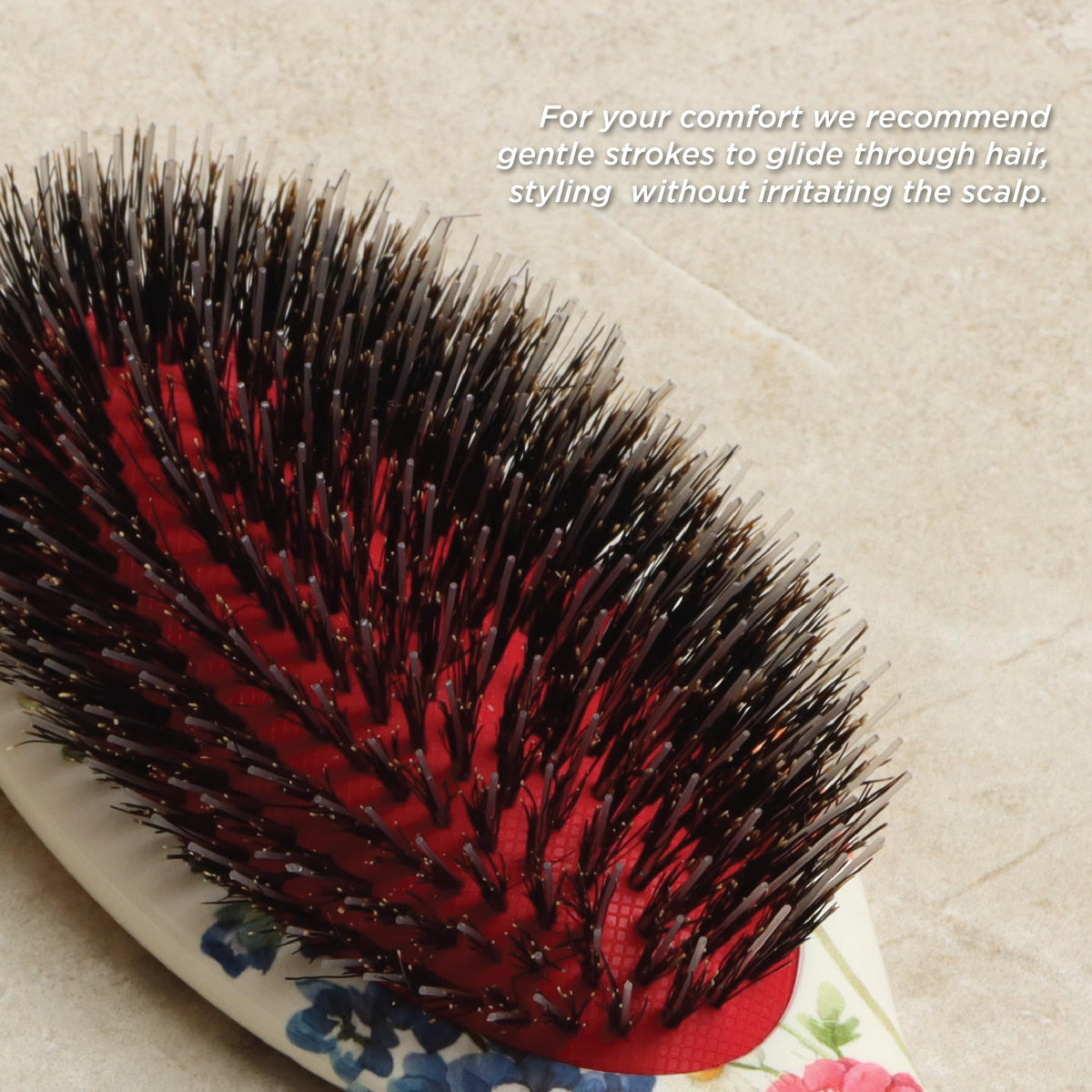 Denman D81M hairbrush being used on curly hair