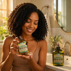 Difeel Jamaican Black Castor Hair Oil Blend on a wooden table