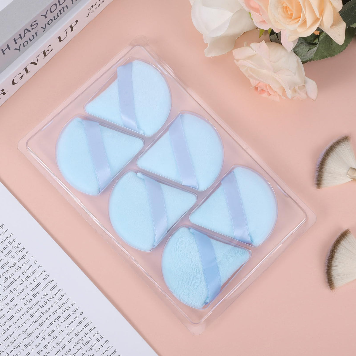 Different angles of Pimoys powder puff triangle design