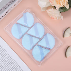 Different angles of Pimoys powder puff triangle design