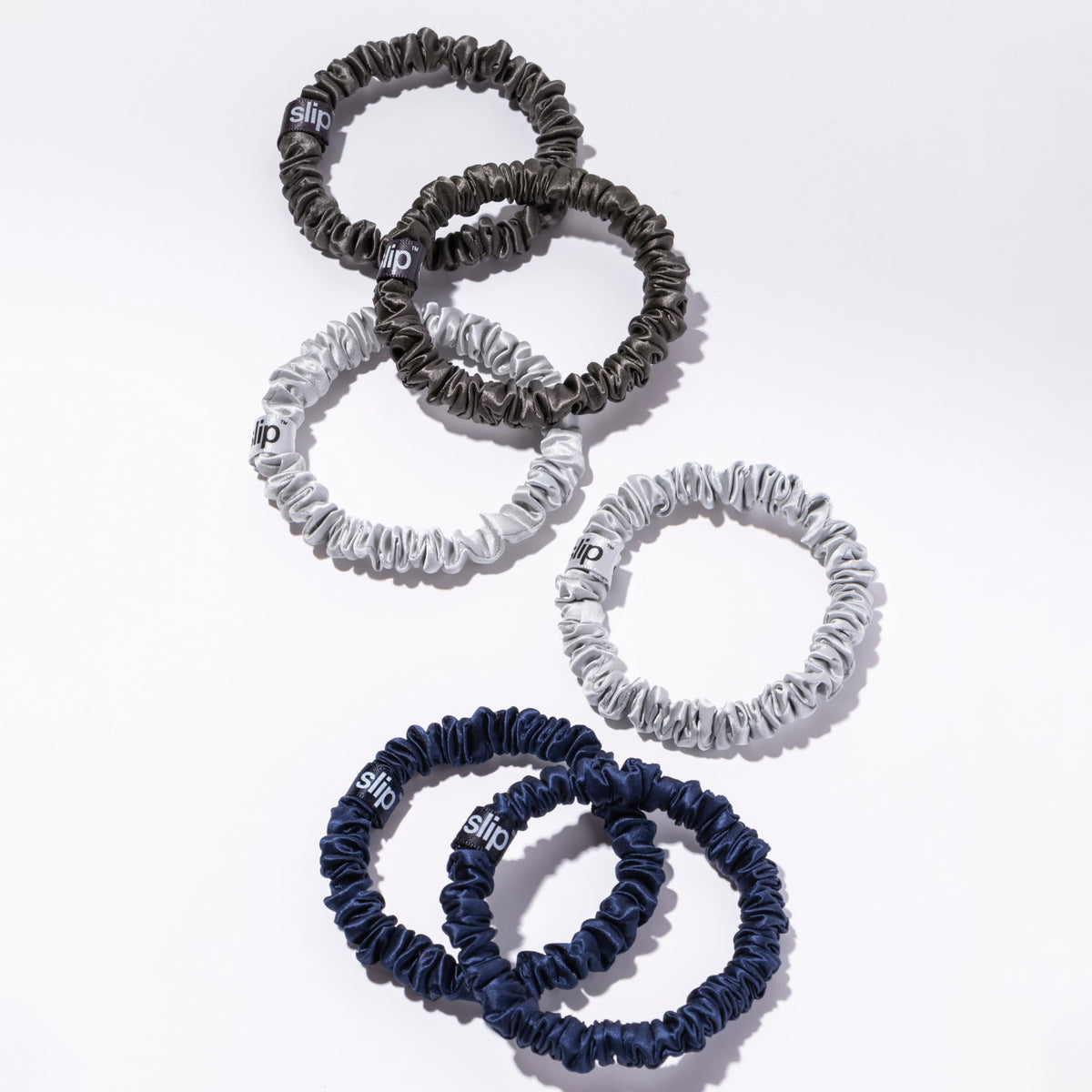 Different angles of SLIP Silk Hair Ties in midnight colour