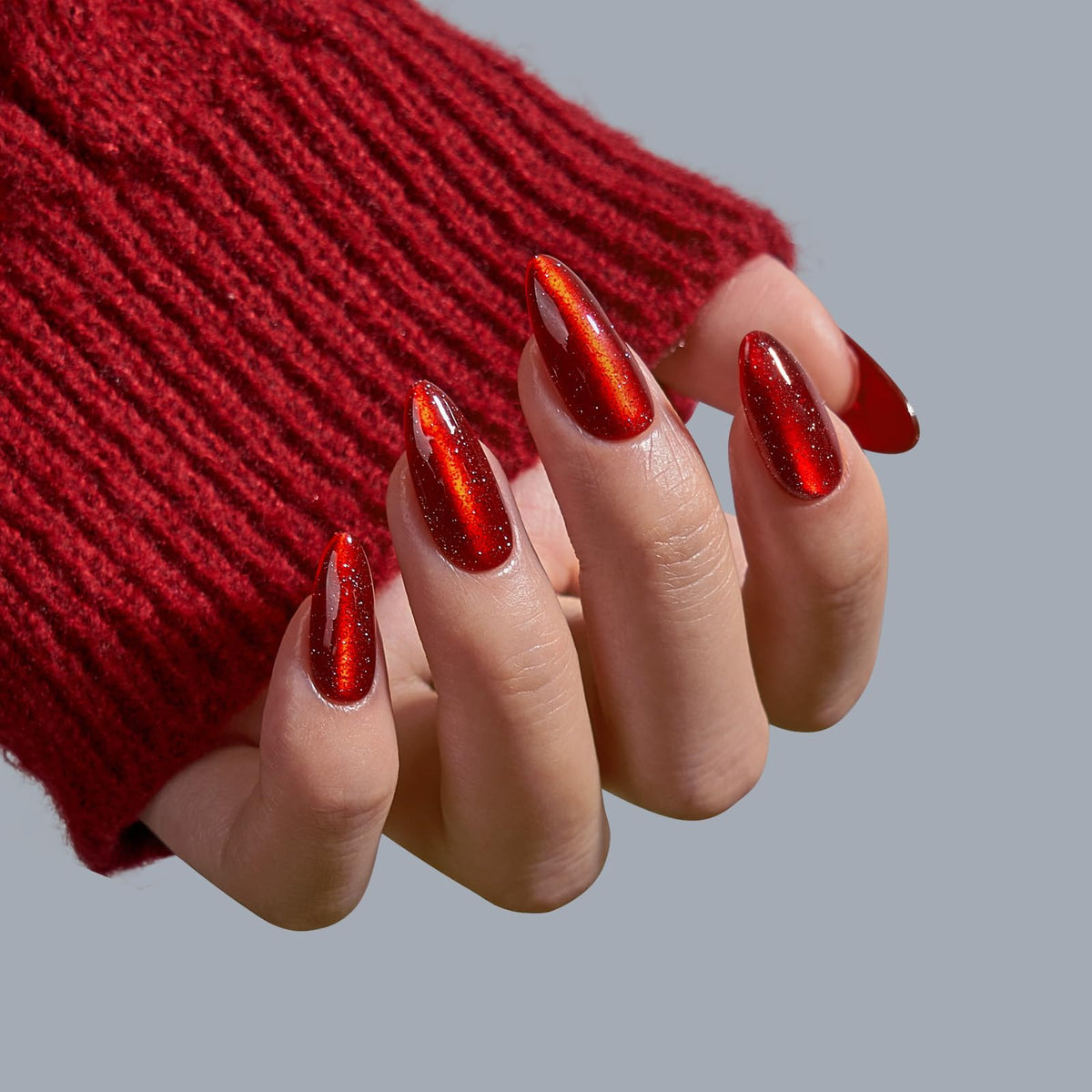 Different sizes of BTArtbox Mystic Ruby Press On Nails laid out for selection