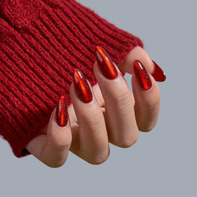 Different sizes of BTArtbox Mystic Ruby Press On Nails laid out for selection