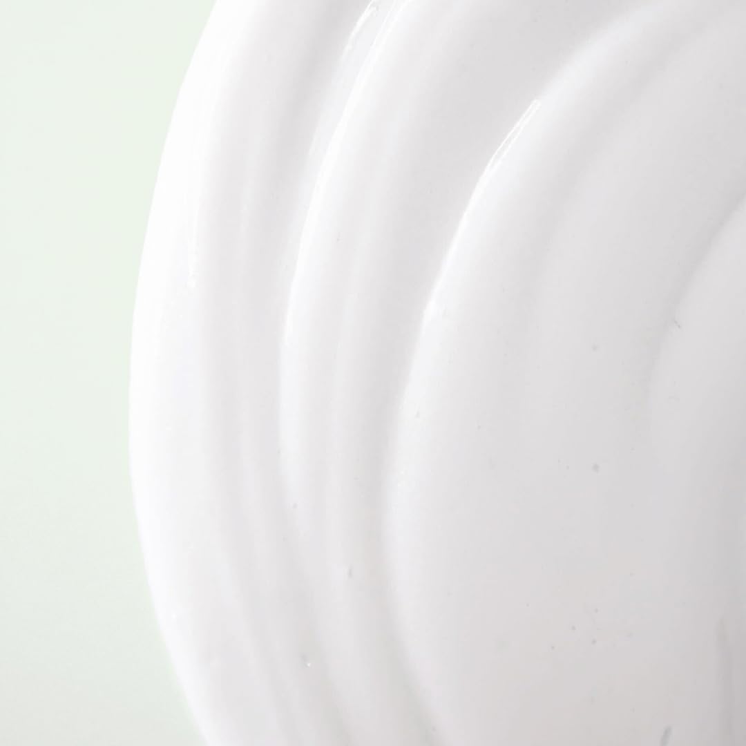 Divi 3-in-1 Leave-In Conditioner beside hairbrush