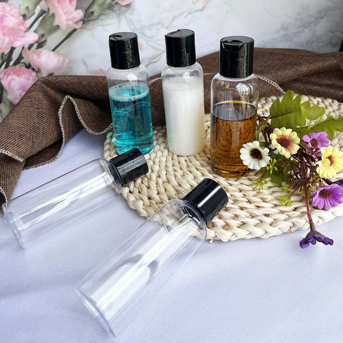 DNSEN Travel Bottles 5 Pack on a bathroom counter