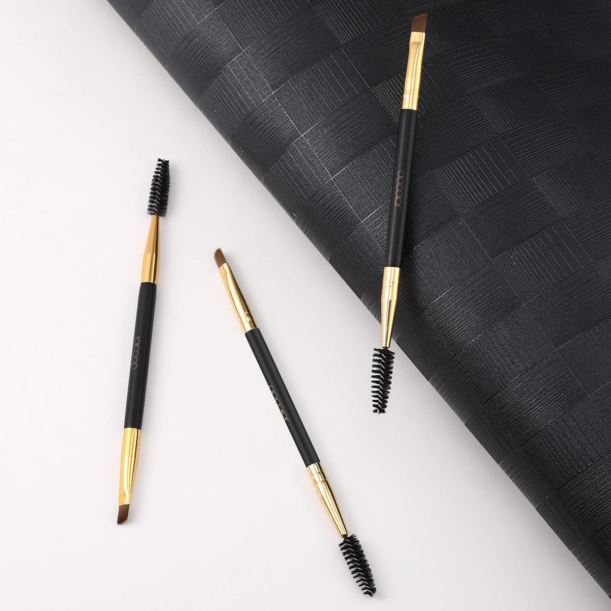 Docolor Eyebrow Brush Duo with a model demonstrating eyebrow grooming