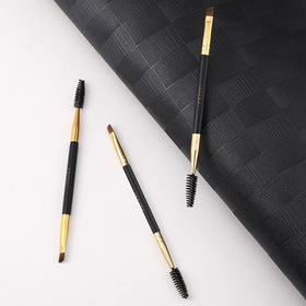 Docolor Eyebrow Brush Duo with a model demonstrating eyebrow grooming