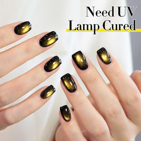 Double Rhythm Cat Eye Gel Nail Polish 15ml Black Gold on a nail art table