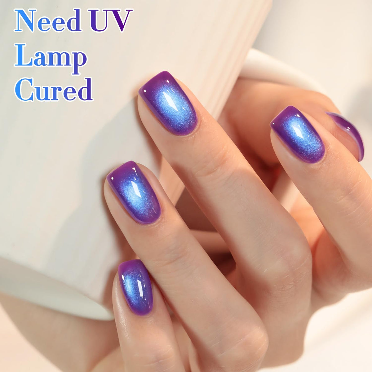 Double Rhythm Cat Eye Gel Polish beside nail lamp for curing