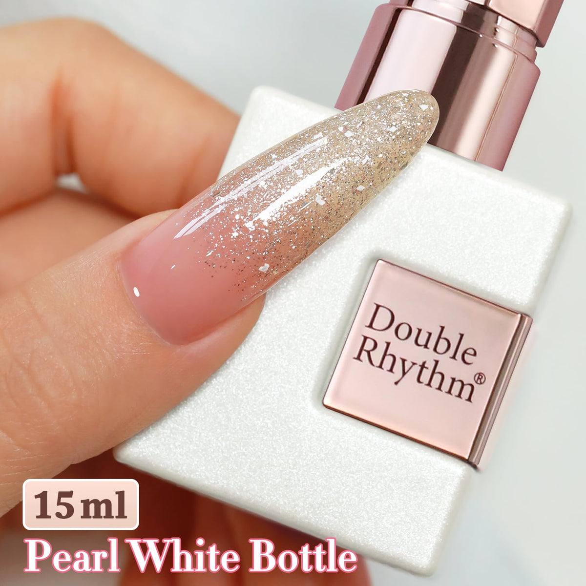 Double Rhythm Glitter Gel Polish Champagne Gold beside nail lamp