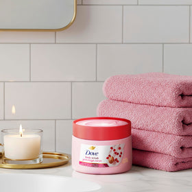 Dove Body Scrub Pomegranate & Shea Butter 15 oz with a towel
