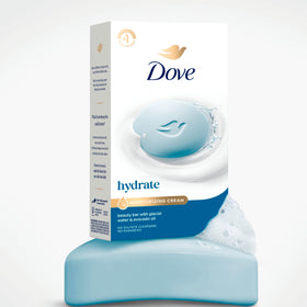 Dove Hydrating Beauty Bar Soap displayed with Dove Body Lotion