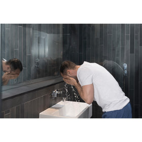 DOVE MEN + CARE Face Wash Hydrate Plus 5 Fl Oz in bathroom setting
