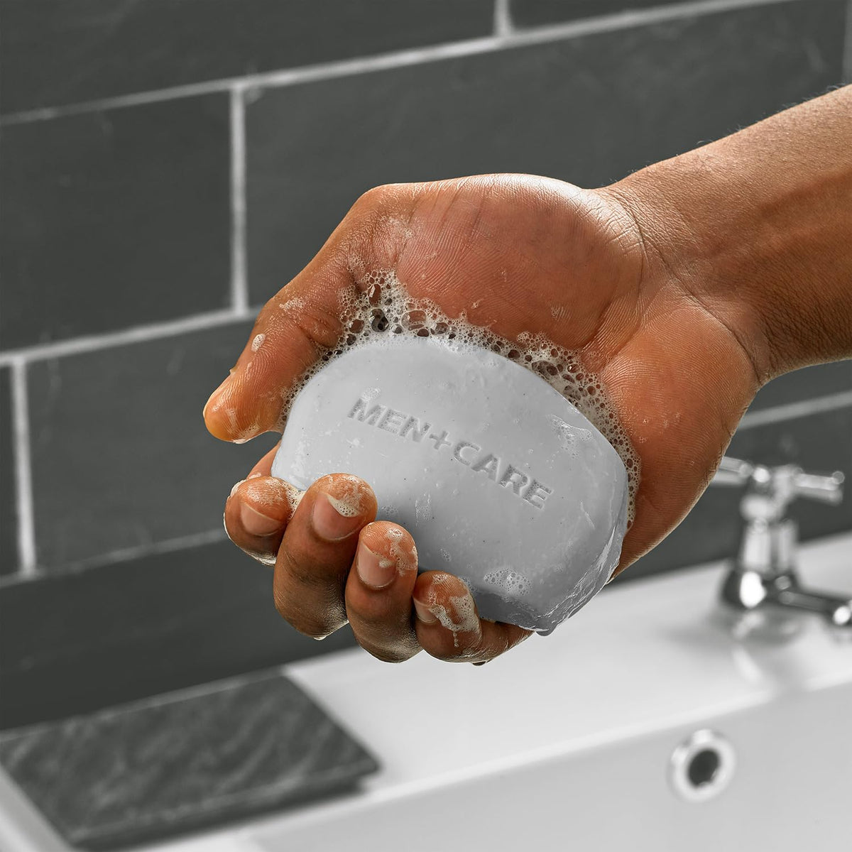 Dove Men+Care soap bundle on a bathroom shelf
