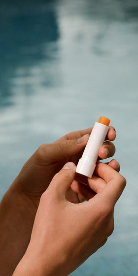 Dr. Hauschka Lip Care Stick in hand for scale