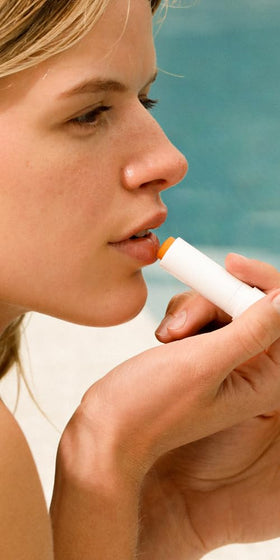 Dr. Hauschka Lip Care Stick side view with ingredients list
