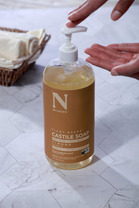 Dr. Natural Castile Liquid Soap 32 oz with various cleaning supplies