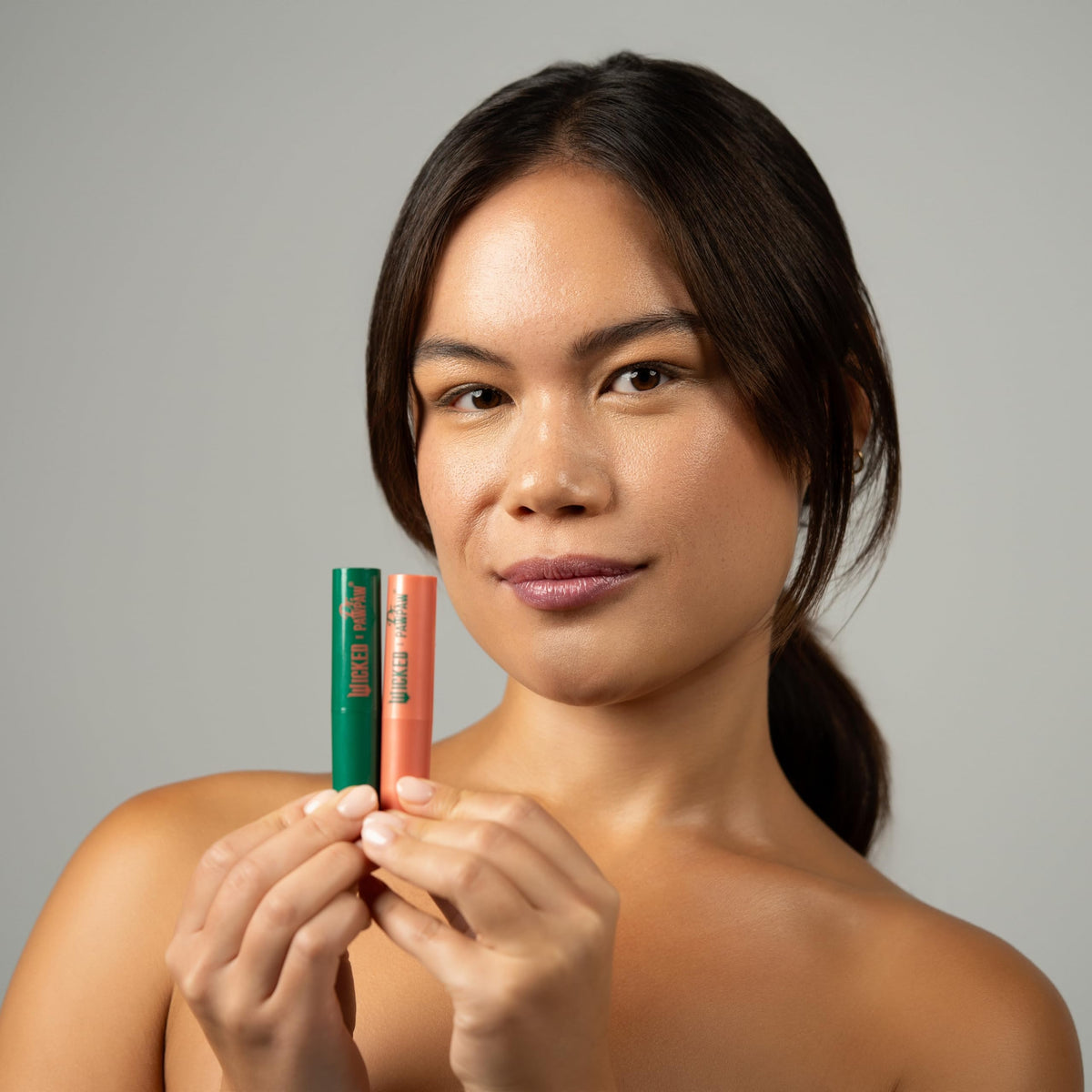 Dr. PAWPAW Enchanting Lip Balm showing colour-changing effect