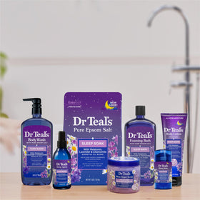 Dr Teal's Foaming Bath Sleep Soak being poured into a bath