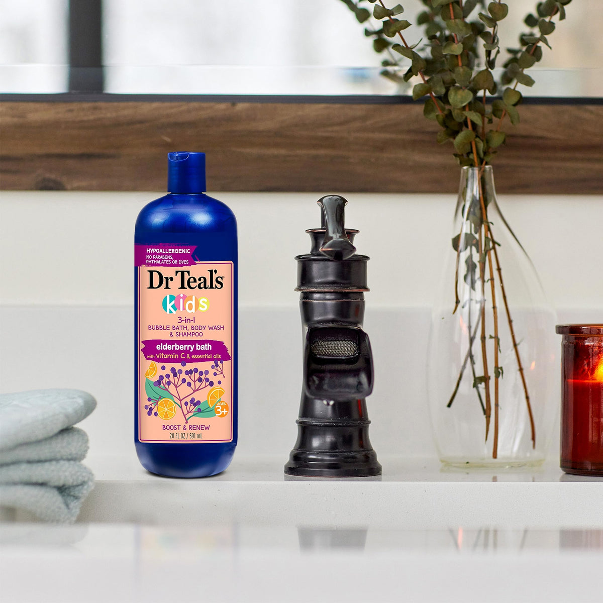 Dr Teal's Kids 3-in-1 Elderberry Bath bottle with a child enjoying bath time