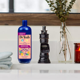 Dr Teal's Kids 3-in-1 Elderberry Bath bottle with a child enjoying bath time