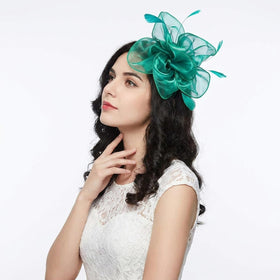 DRESHOW Fascinator Hat displayed on a model at a tea party