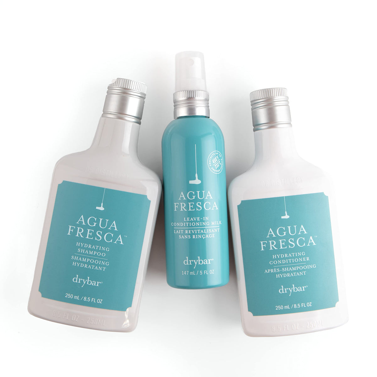 Drybar Agua Fresca Hydrating Conditioner 8.5 oz with floral background