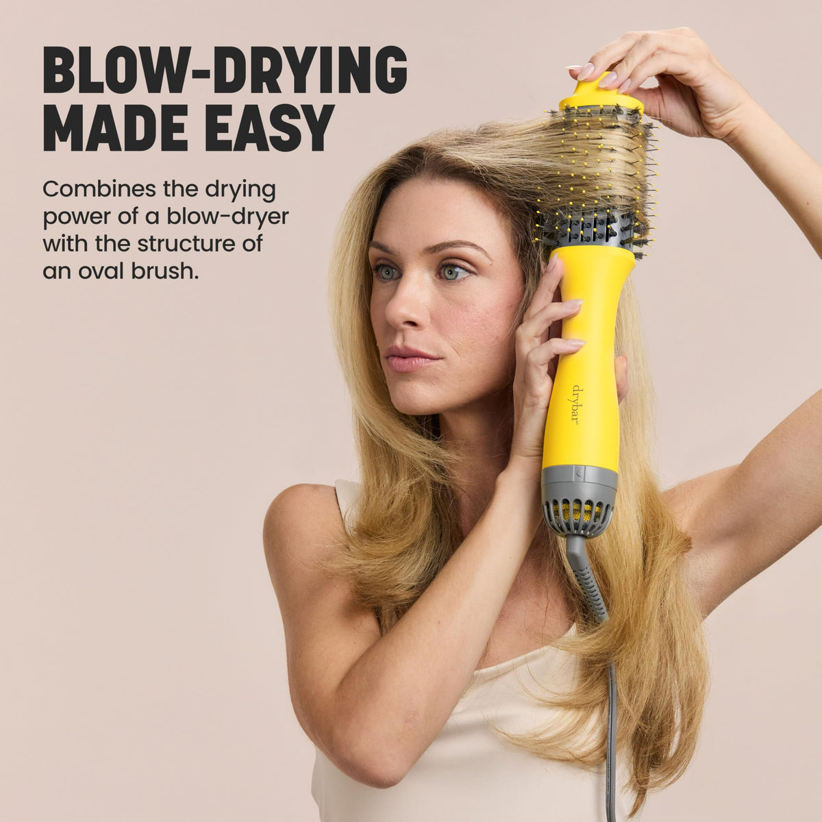 Drybar The Double Shot brush in use on hair