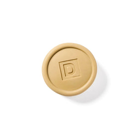 Duke Cannon Bar Soap Puck with natural ingredients background
