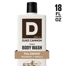 Duke Cannon body wash on a bathroom shelf with grooming products
