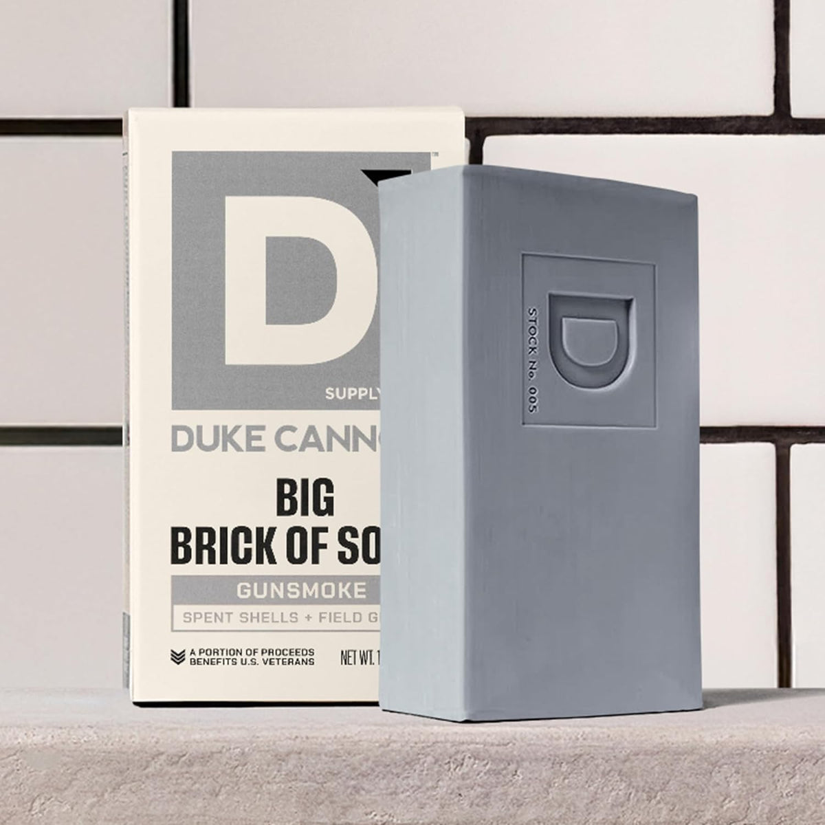 Duke Cannon Extra Large Bar Soap being lathered with a loofah