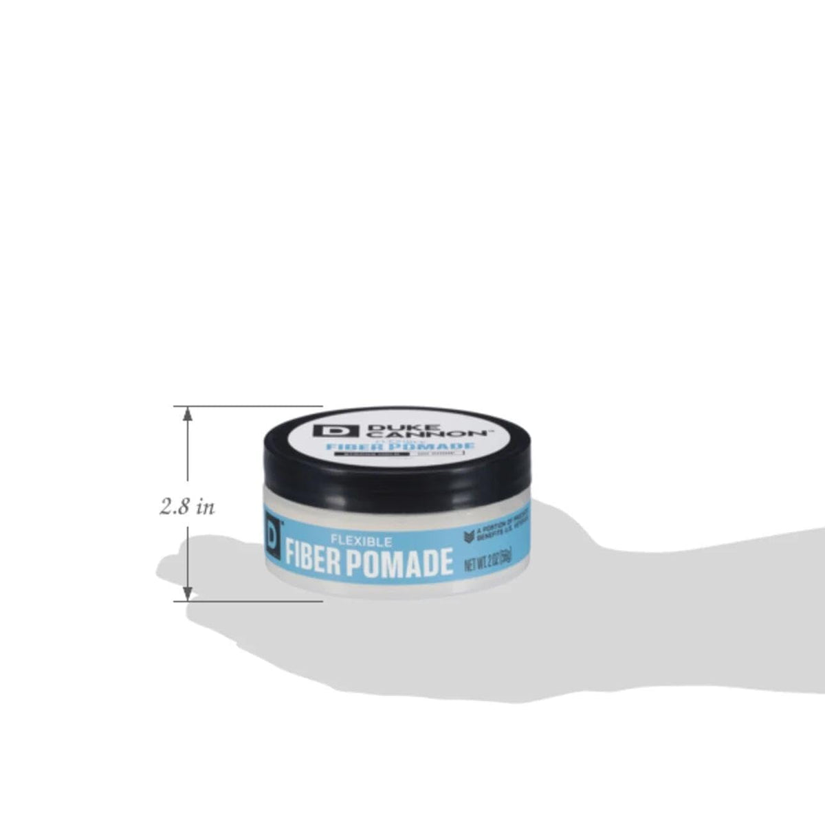 Duke Cannon Fiber Pomade 2 oz displayed on grooming table