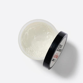 Duke Cannon pomade in a grooming setup