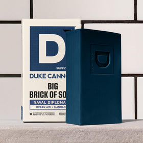 Duke Cannon soap with a background of ocean waves