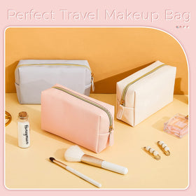 Dunzy small toiletry bags stacked in soft colours
