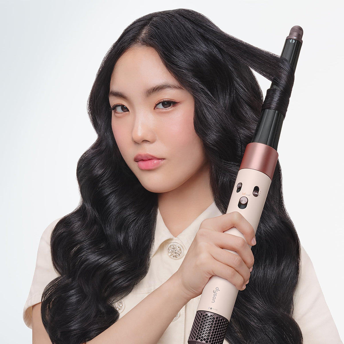 Dyson Airwrap i.d. Multi-Styler in use on wavy hair