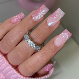 DZPGUONIZ Medium Hot Pink Press On Nails front view with flower design