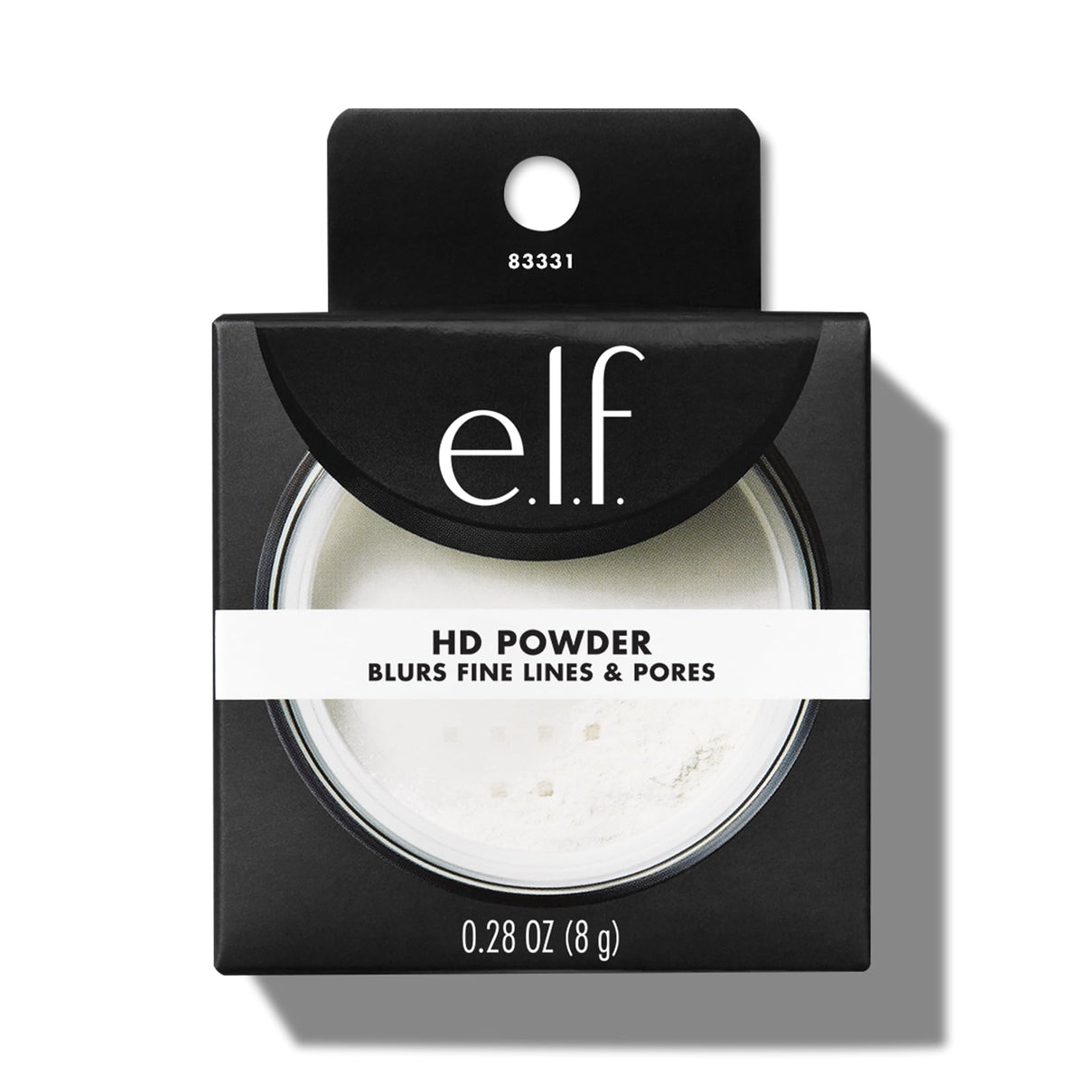 e.l.f. High Definition Loose Powder on vanity with makeup brushes