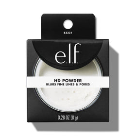 e.l.f. High Definition Loose Powder on vanity with makeup brushes