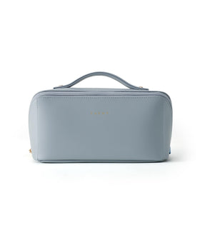 EACHY Travel Makeup Bag packed with cosmetics on a bathroom counter