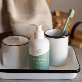 Earth Mama Belly Butter 8oz with application on skin