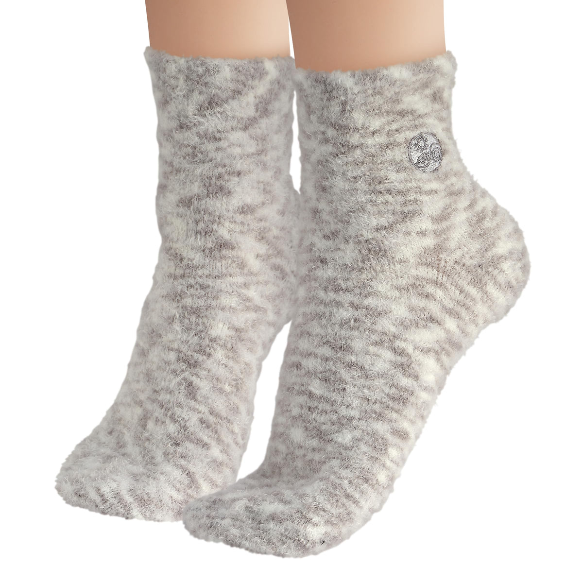 Earth Therapeutics Aloe Socks displayed on a wooden surface