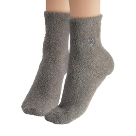 Earth Therapeutics Aloe Socks in a laundry basket for care instructions