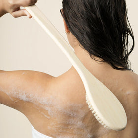 EcoTools Bath Bristle Brush in use with body wash