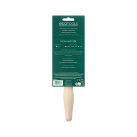 EcoTools Dual Bristle Hair Brush held in hand demonstrating grip
